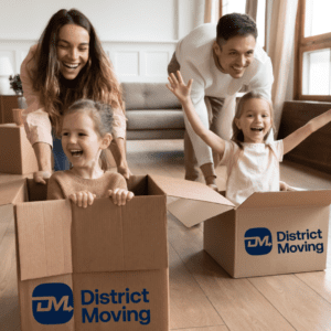 parents having fun pushing kids in moving boxes